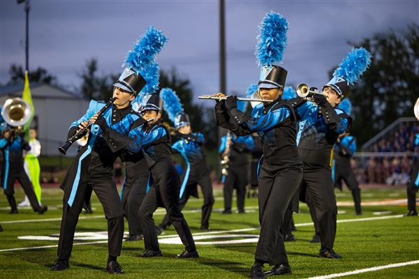 The Centennial High marching band performs